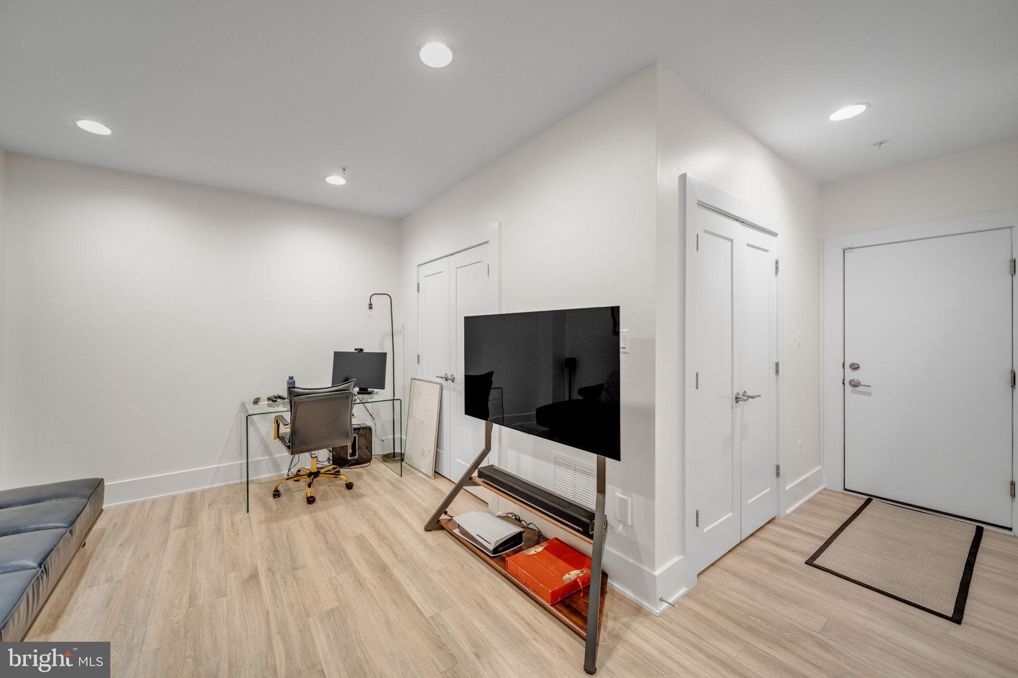 11326 Emerald Park Road Potomac, MD 20854 - Photo 30 of 40 a living room with furniture and a flat screen tv