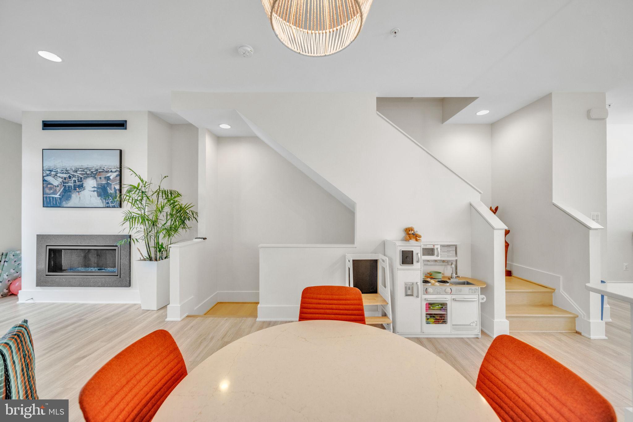 11326 Emerald Park Road Potomac, MD 20854 - Photo 6 of 40 a living room with furniture and a fireplace