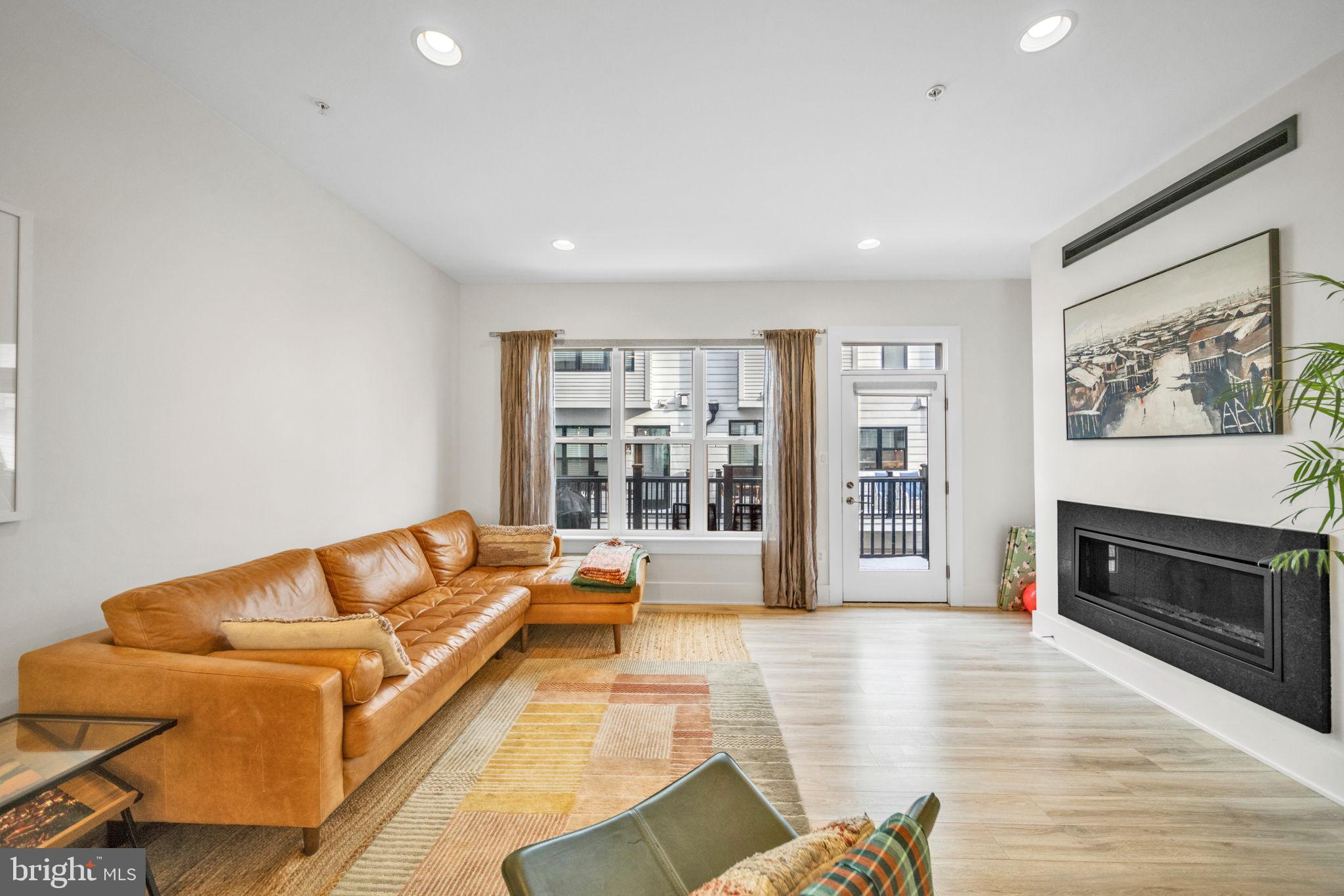 11326 Emerald Park Road Potomac, MD 20854 - Photo 9 of 40 a living room with furniture and a fireplace