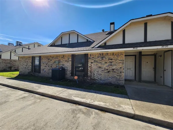 a front view of a house with a garage