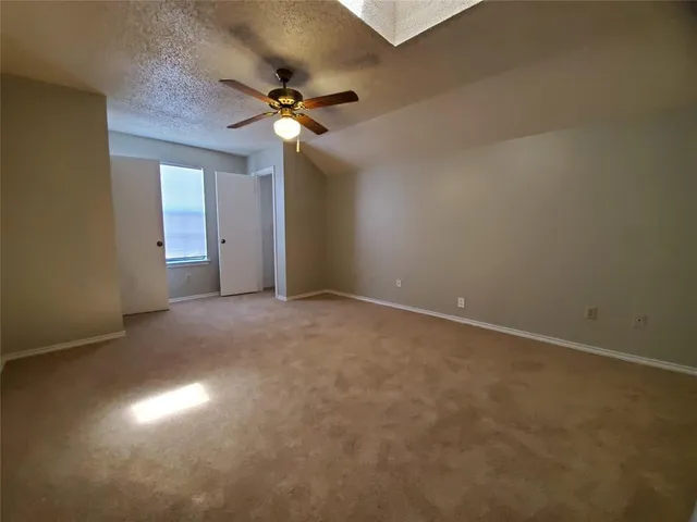 an empty room with a empty space and windows