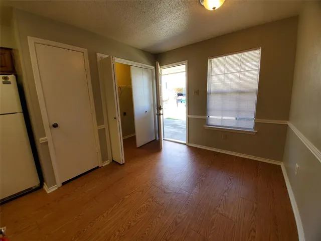 a kitchen with stainless steel appliances a refrigerator sink and cabinets