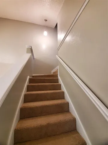 a view of an empty room with a fan