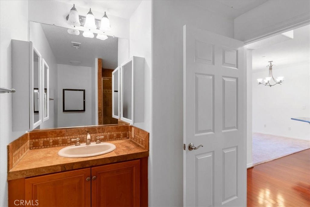 21345 Hawthorne Boulevard, Unit 217 Torrance, CA 90503 - Photo 11 of 41 a bathroom with a sink and a mirror