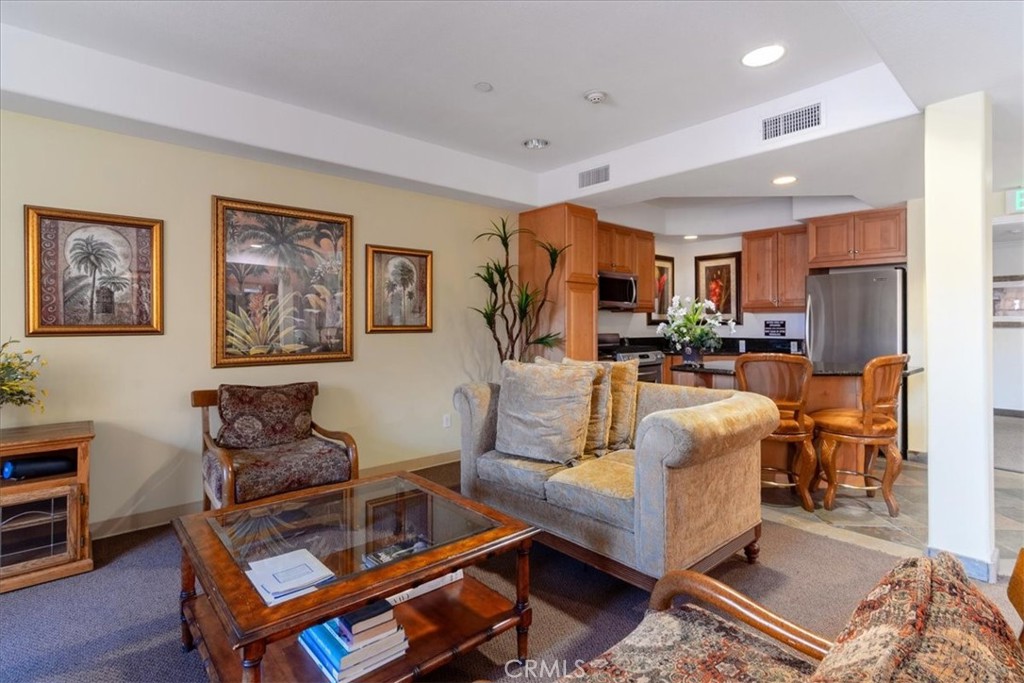 21345 Hawthorne Boulevard, Unit 217 Torrance, CA 90503 - Photo 23 of 41 a living room with furniture and a view of kitchen