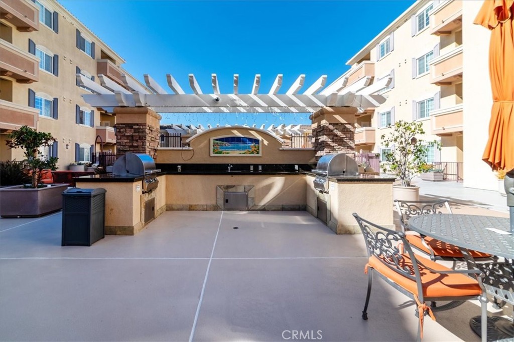 21345 Hawthorne Boulevard, Unit 217 Torrance, CA 90503 - Photo 28 of 41 a view of a chairs and table in a patio