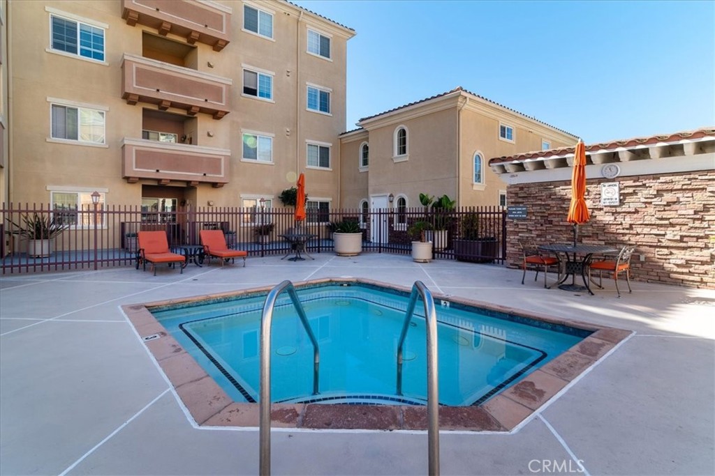 21345 Hawthorne Boulevard, Unit 217 Torrance, CA 90503 - Photo 29 of 41 a view of a swimming pool with a lounge chair