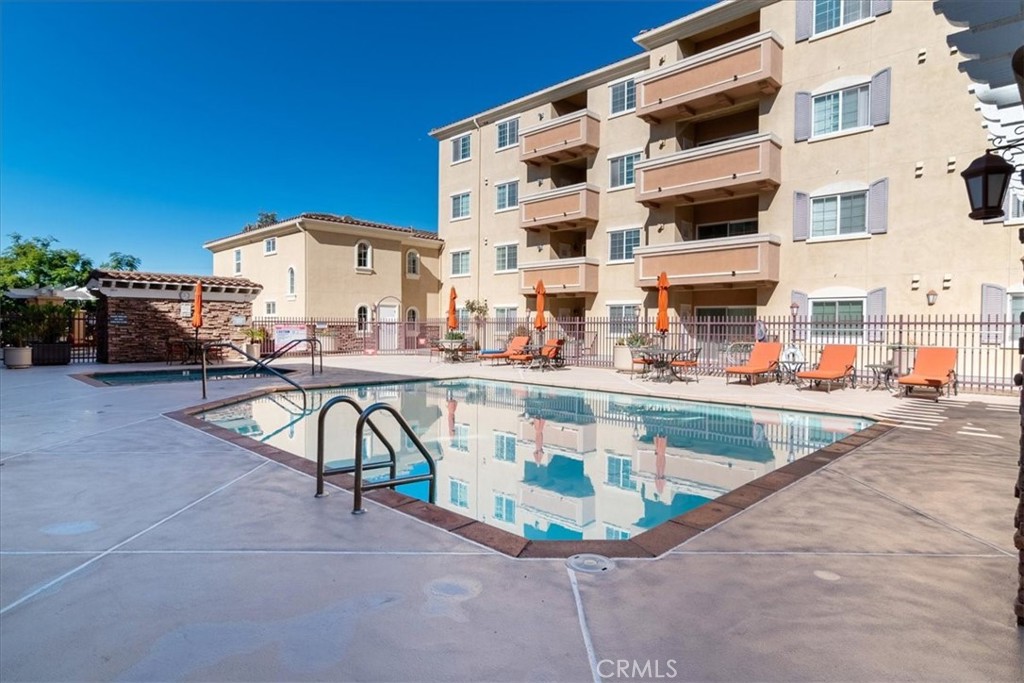 21345 Hawthorne Boulevard, Unit 217 Torrance, CA 90503 - Photo 30 of 41 a view of a swimming pool with a lounge chairs