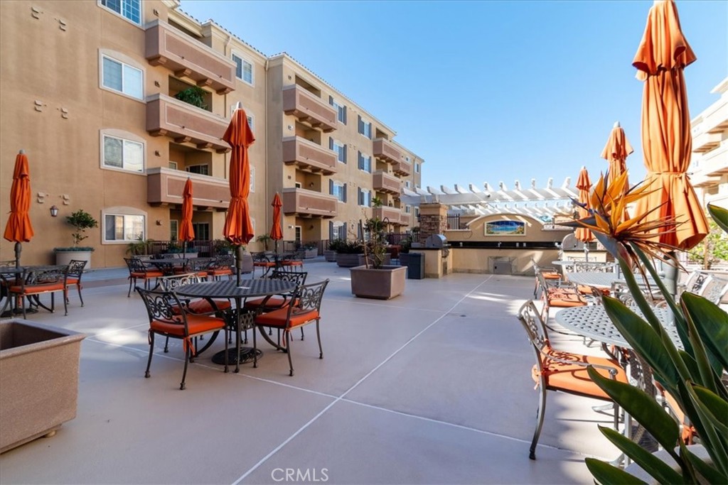 21345 Hawthorne Boulevard, Unit 217 Torrance, CA 90503 - Photo 33 of 41 a row of table and chairs in the patio