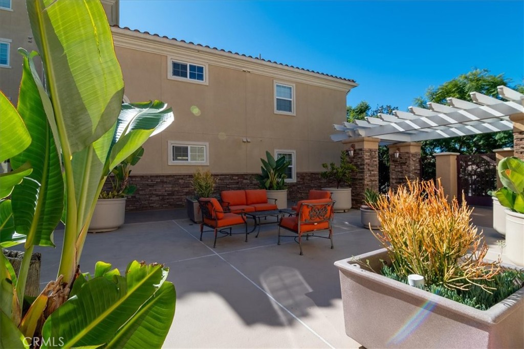 21345 Hawthorne Boulevard, Unit 217 Torrance, CA 90503 - Photo 35 of 41 a view of a chairs and table in patio