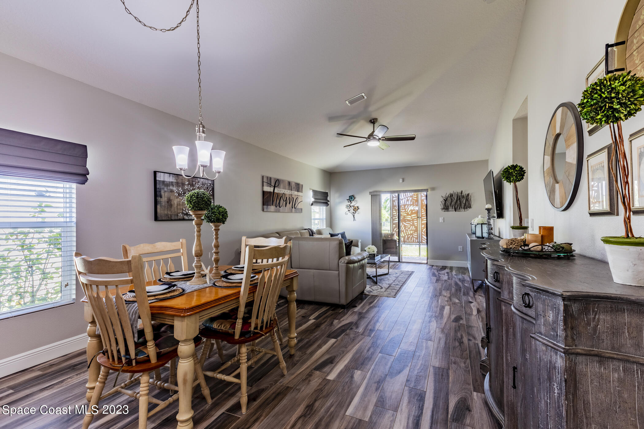 2995 Louetta Circle Melbourne, FL 32901 - Photo 20 of 42 a view of a dining room with furniture window and wooden floor