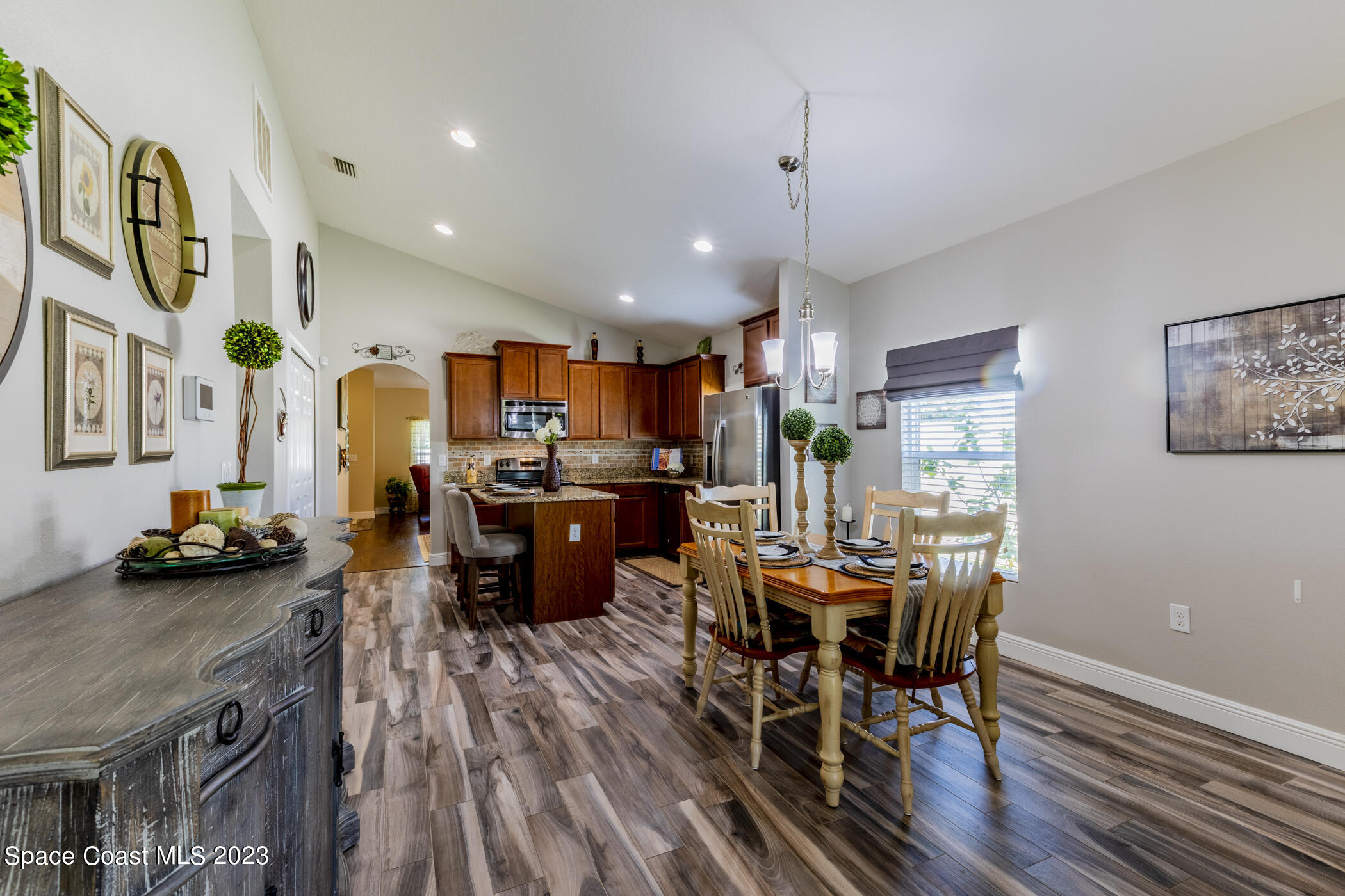 2995 Louetta Circle Melbourne, FL 32901 - Photo 21 of 42 a view of a dining room with furniture window and wooden floor