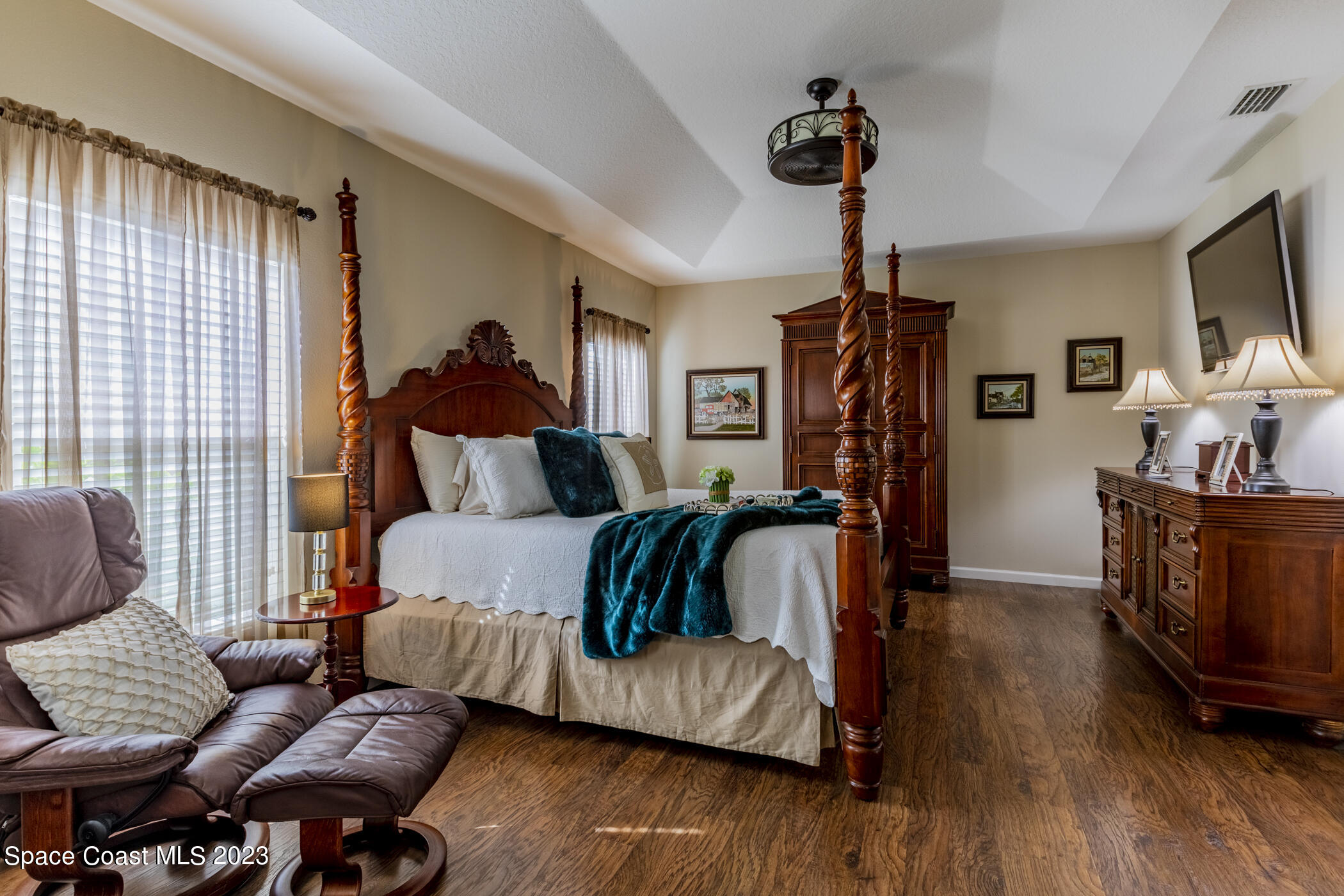 2995 Louetta Circle Melbourne, FL 32901 - Photo 27 of 42 a living room with furniture and a flat screen tv