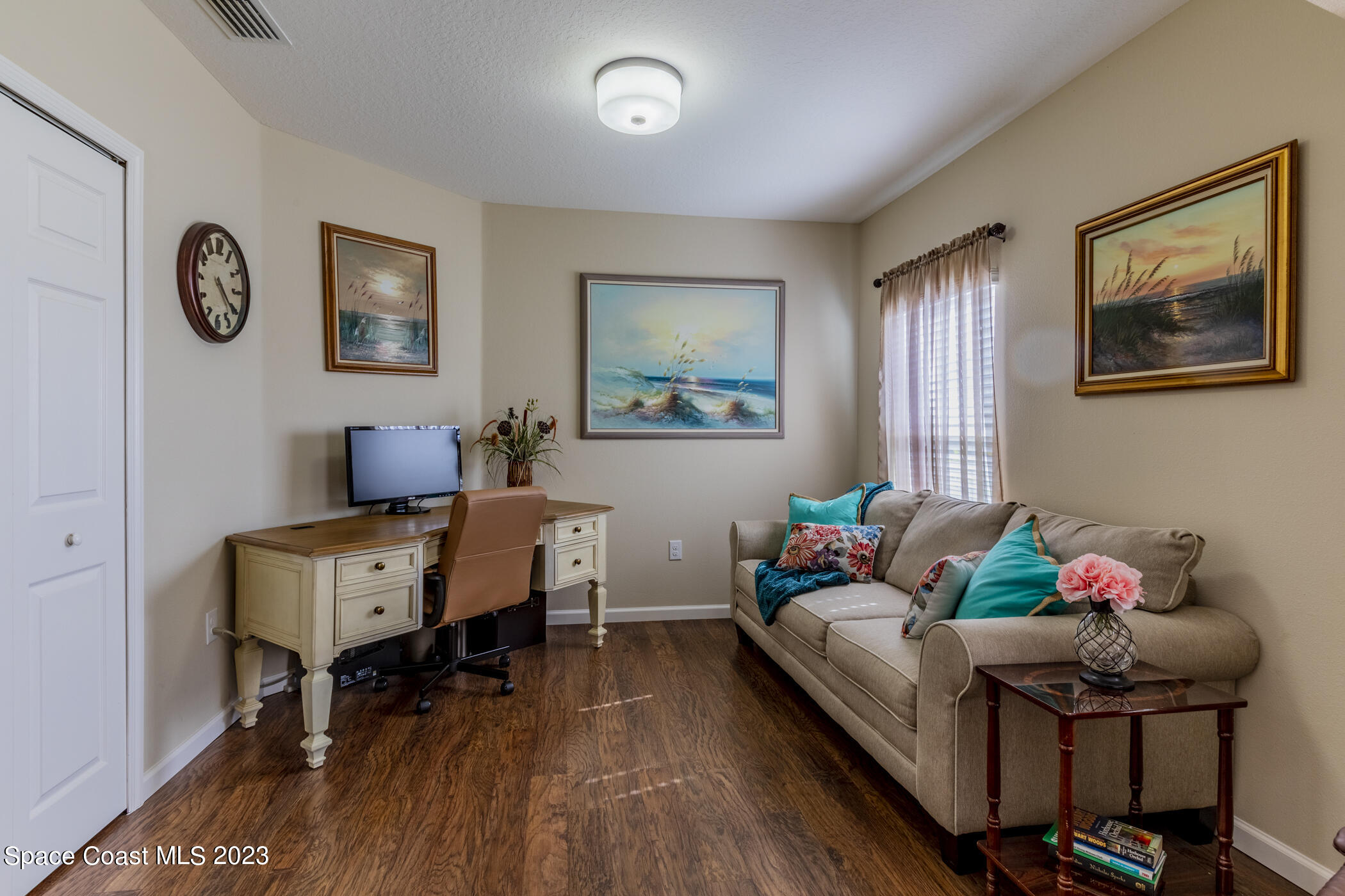 2995 Louetta Circle Melbourne, FL 32901 - Photo 29 of 42 a living room with furniture and wooden floor