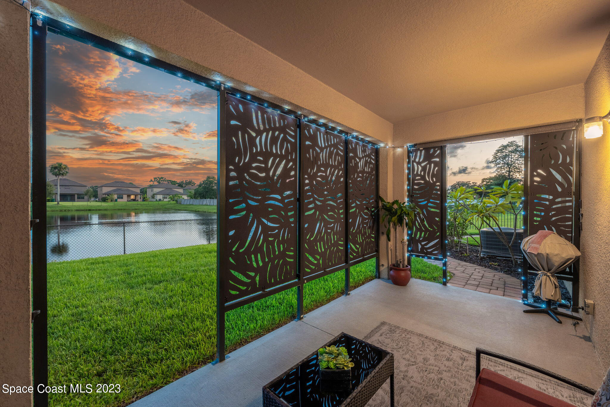 2995 Louetta Circle Melbourne, FL 32901 - Photo 30 of 42 a view of a chair and table in backyard of a house