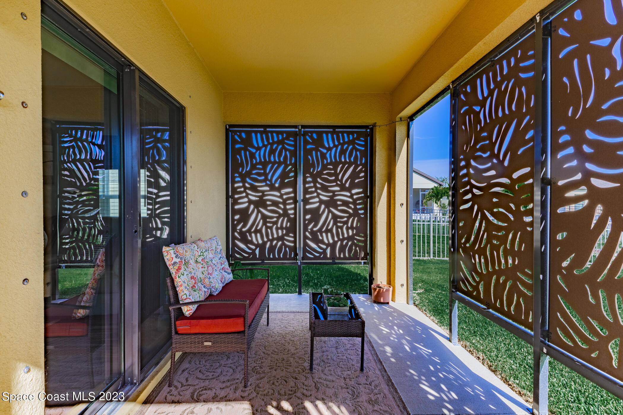 2995 Louetta Circle Melbourne, FL 32901 - Photo 35 of 42 a wooden bench sitting in front of a building