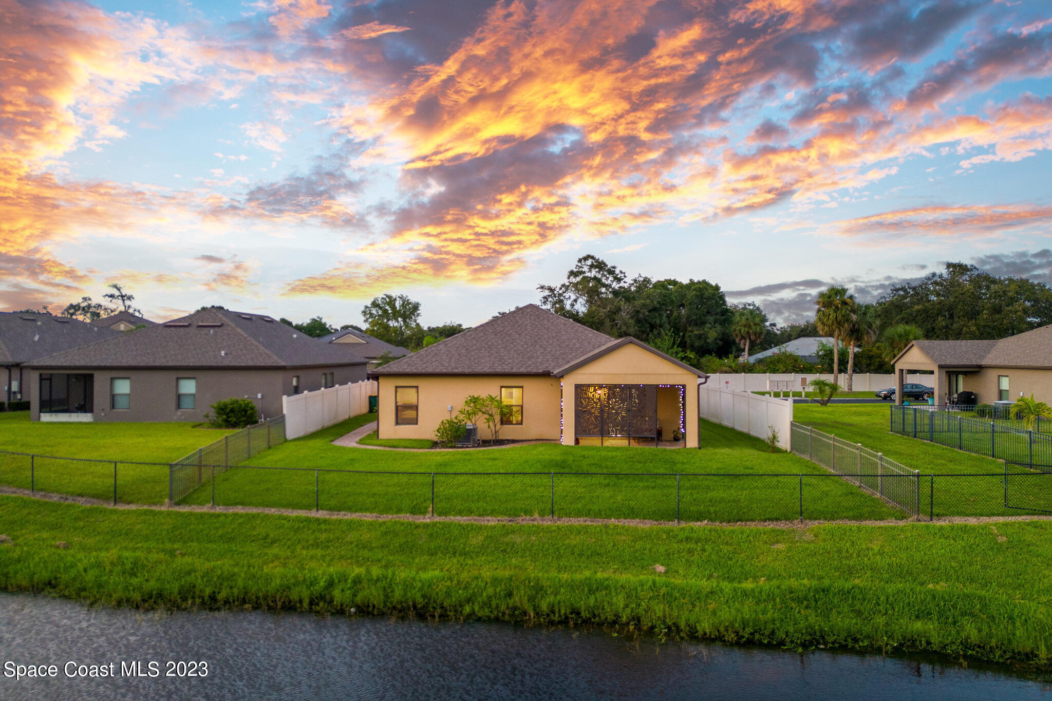 2995 Louetta Circle Melbourne, FL 32901 - Photo 38 of 42 a front view of a house with a yard