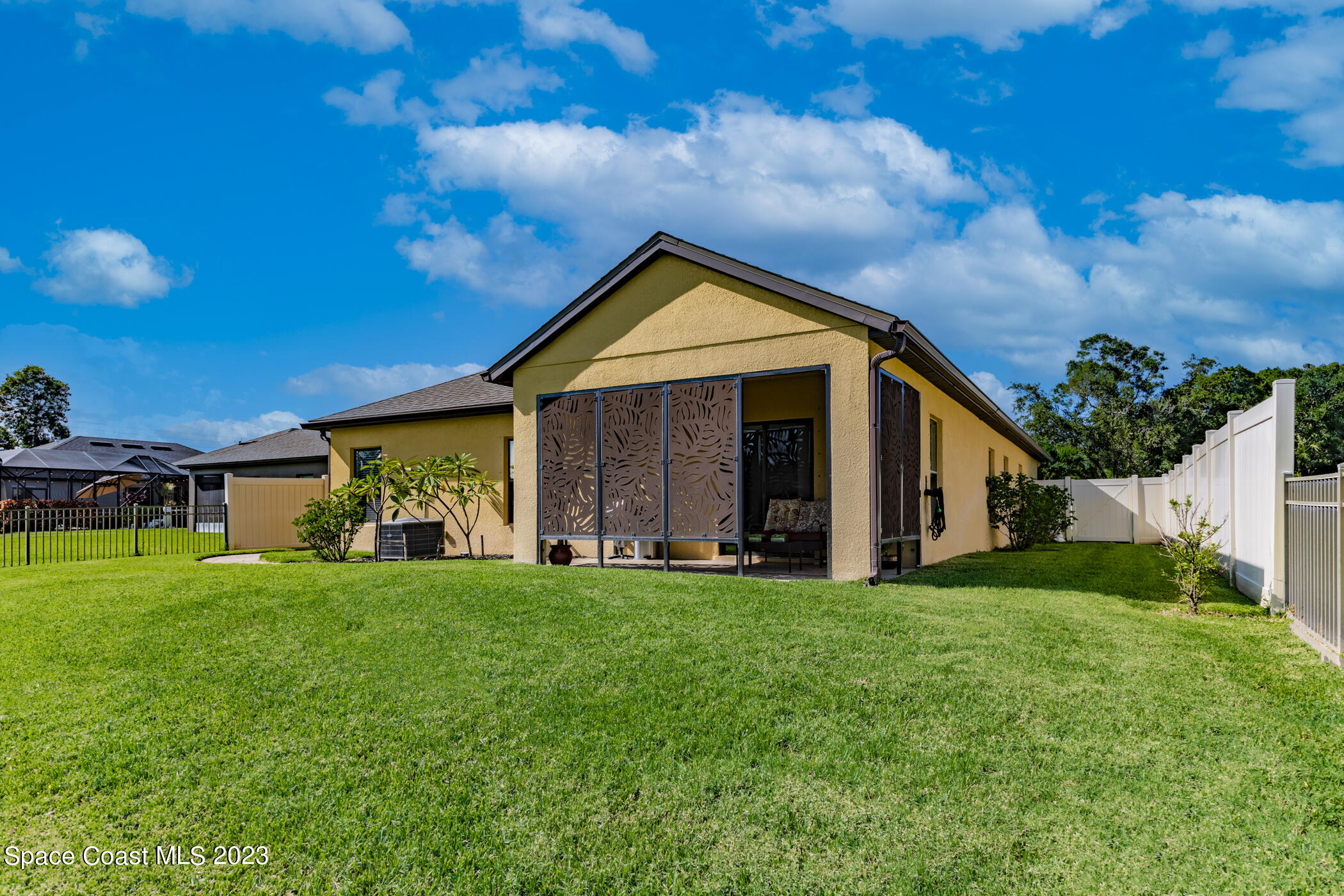2995 Louetta Circle Melbourne, FL 32901 - Photo 40 of 42 a front view of a house with a yard