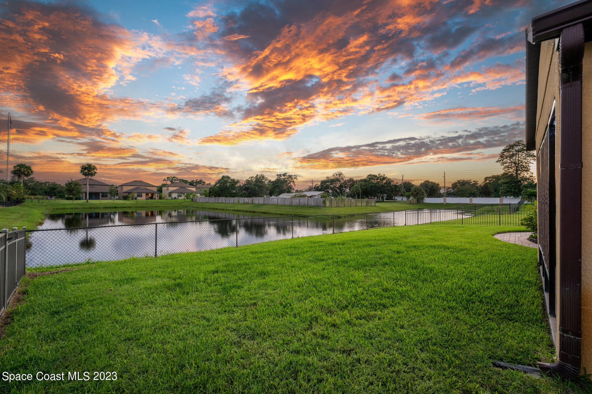 2995 Louetta Circle Melbourne, FL 32901 - Photo 4 of 42 a view of a lake with houses in the back