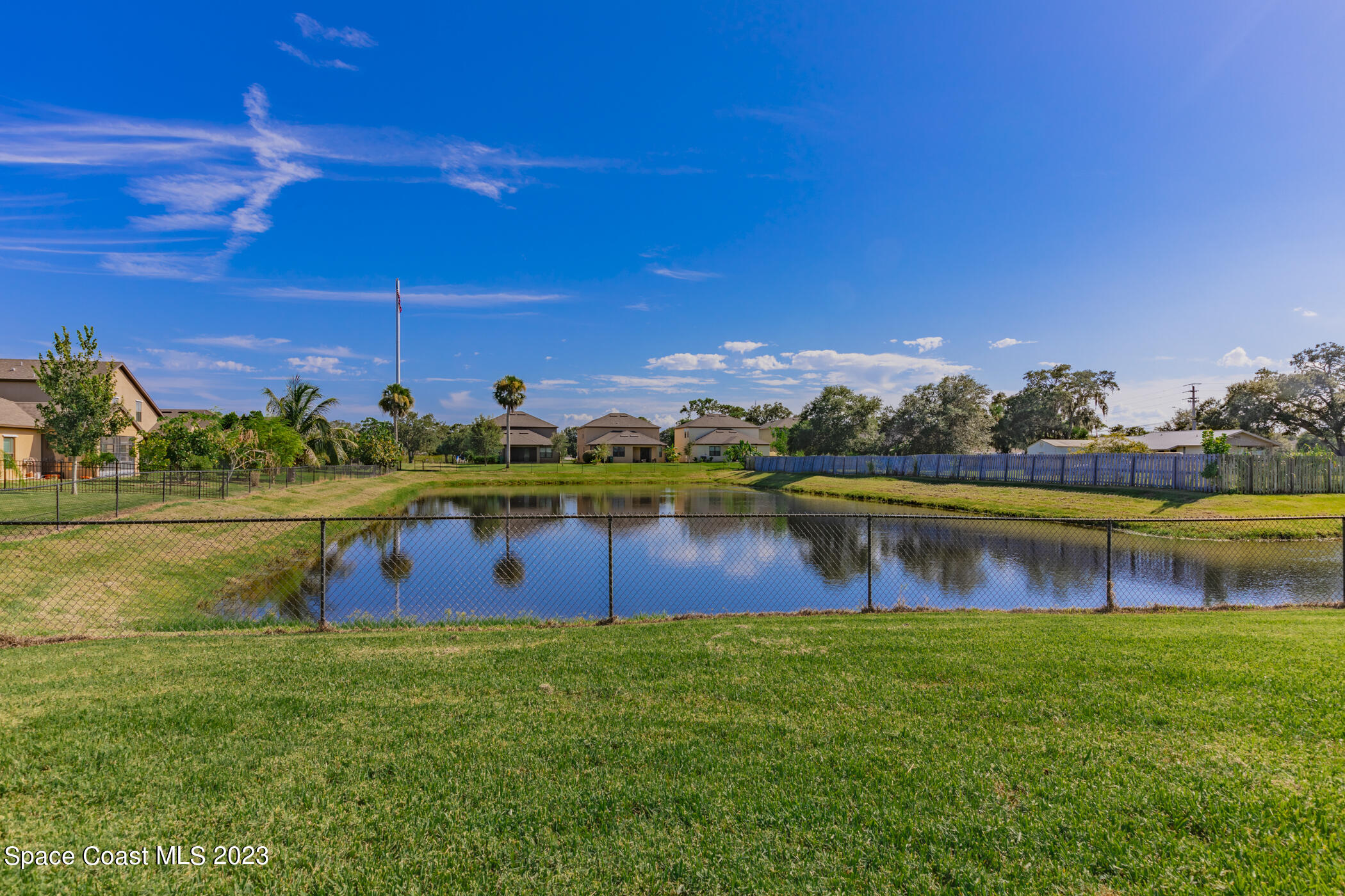 2995 Louetta Circle Melbourne, FL 32901 - Photo 5 of 42 a view of a lake with a house in the background