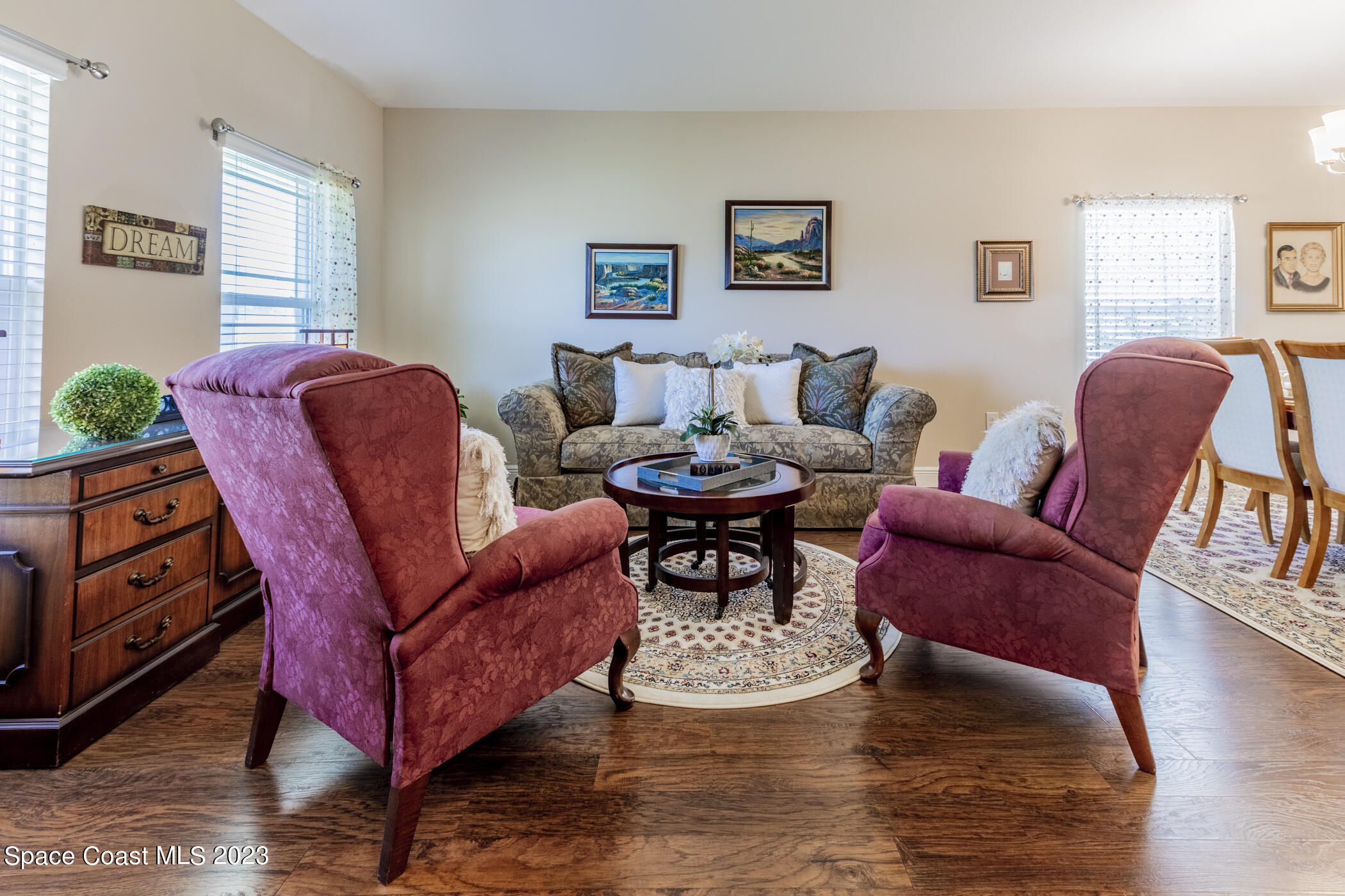 2995 Louetta Circle Melbourne, FL 32901 - Photo 9 of 42 a living room with furniture and wooden floor
