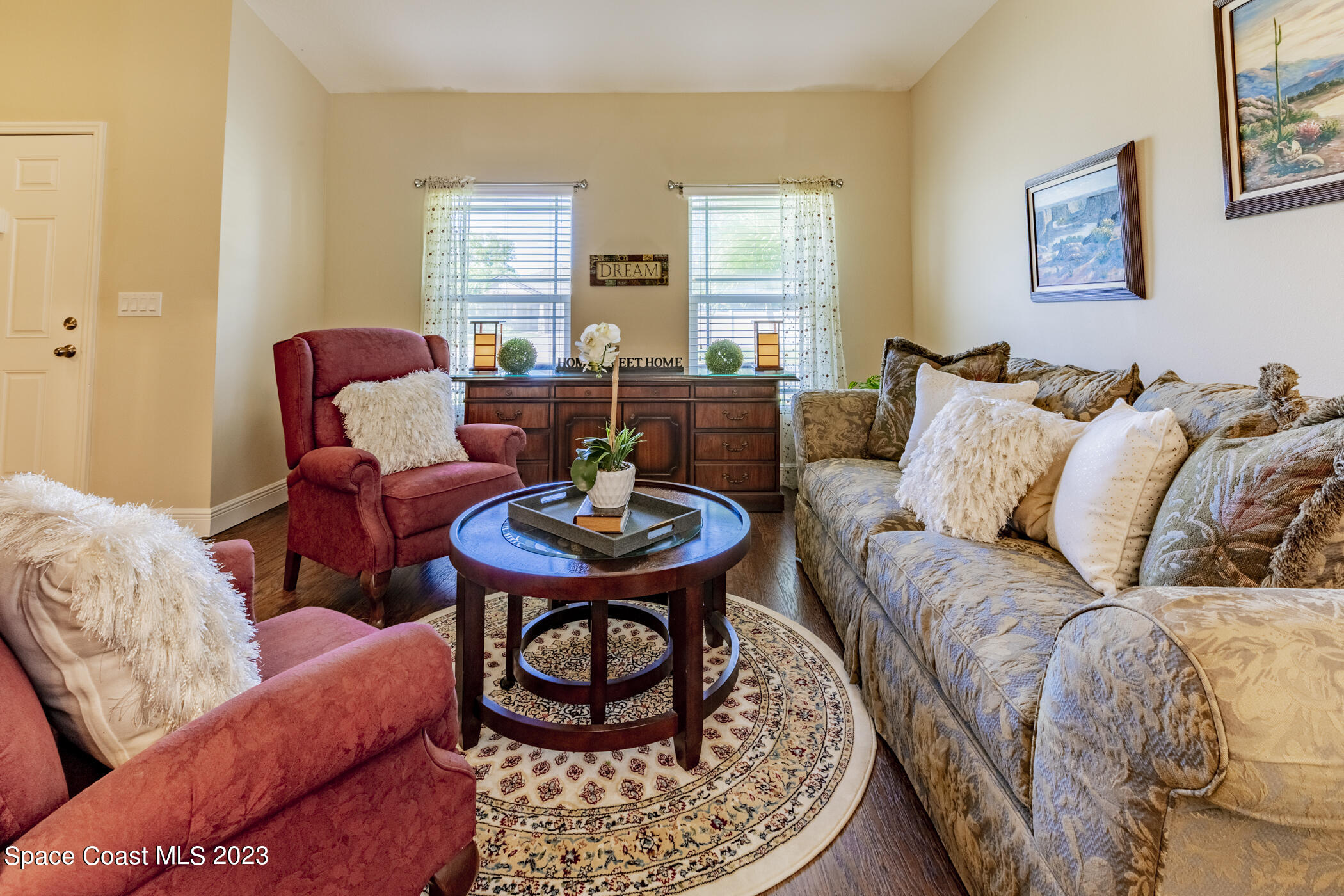 2995 Louetta Circle Melbourne, FL 32901 - Photo 10 of 42 a living room with furniture and a wooden floor