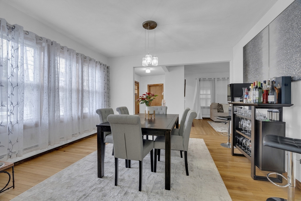 64 Commonwealth Road Watertown, MA 02472 - Photo 5 of 23 a view of a dining room with furniture and a potted plant