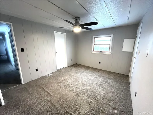 a view of empty room with fan