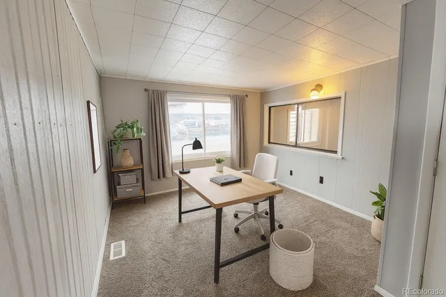 a room with furniture a window and potted plants
