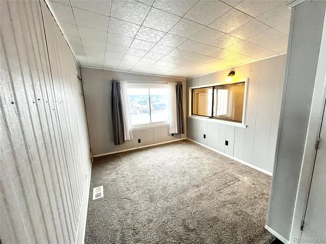 a view of empty room with windows