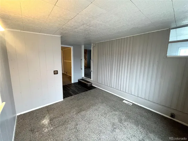 a white kitchen with a sink and cabinets