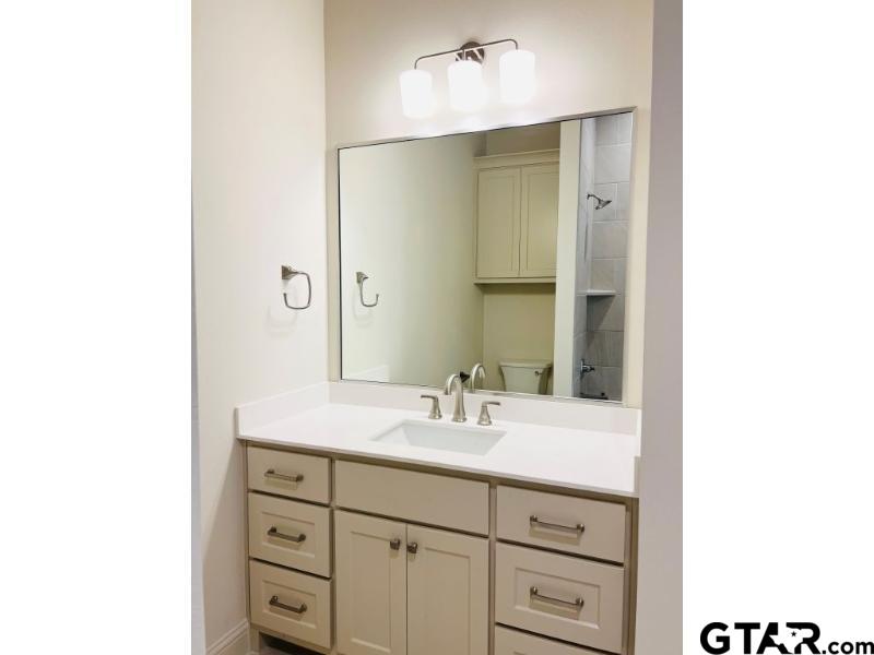 2983 Guinn Farms Road Tyler, TX 75707 - Photo 17 of 22 a bathroom with a sink double vanity and a mirror