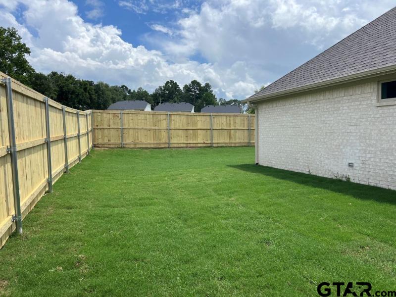 2983 Guinn Farms Road Tyler, TX 75707 - Photo 21 of 22 a view of a backyard with a lake