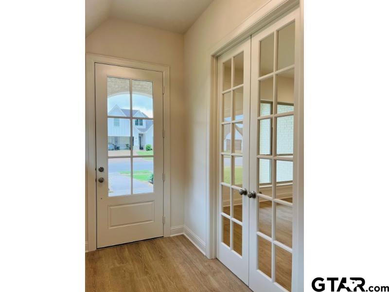 2983 Guinn Farms Road Tyler, TX 75707 - Photo 4 of 22 a view of an entryway with wooden floor