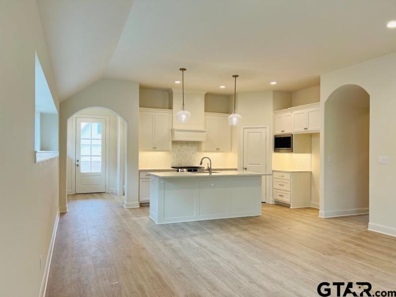 2983 Guinn Farms Road Tyler, TX 75707 - Photo 5 of 22 a large white kitchen with a large window