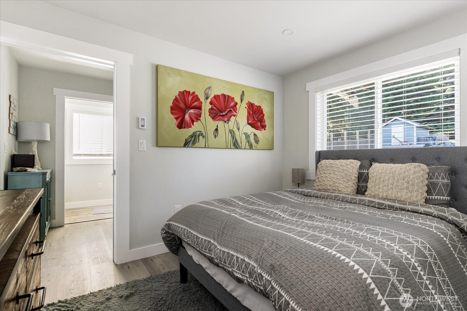 159 South Harrington Lagoon Road Coupeville, WA 98239 - Photo 14 of 37 a bedroom with a bed and a painting on the wall