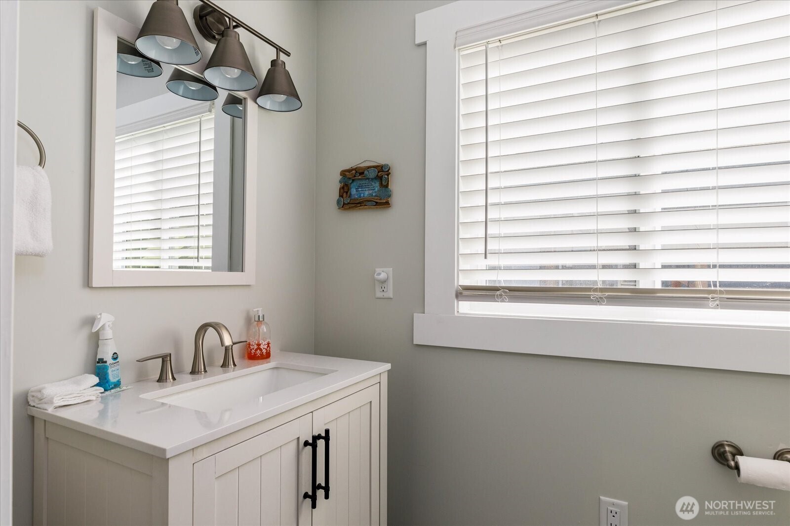 159 South Harrington Lagoon Road Coupeville, WA 98239 - Photo 15 of 37 a bathroom with a sink a vanity and a window