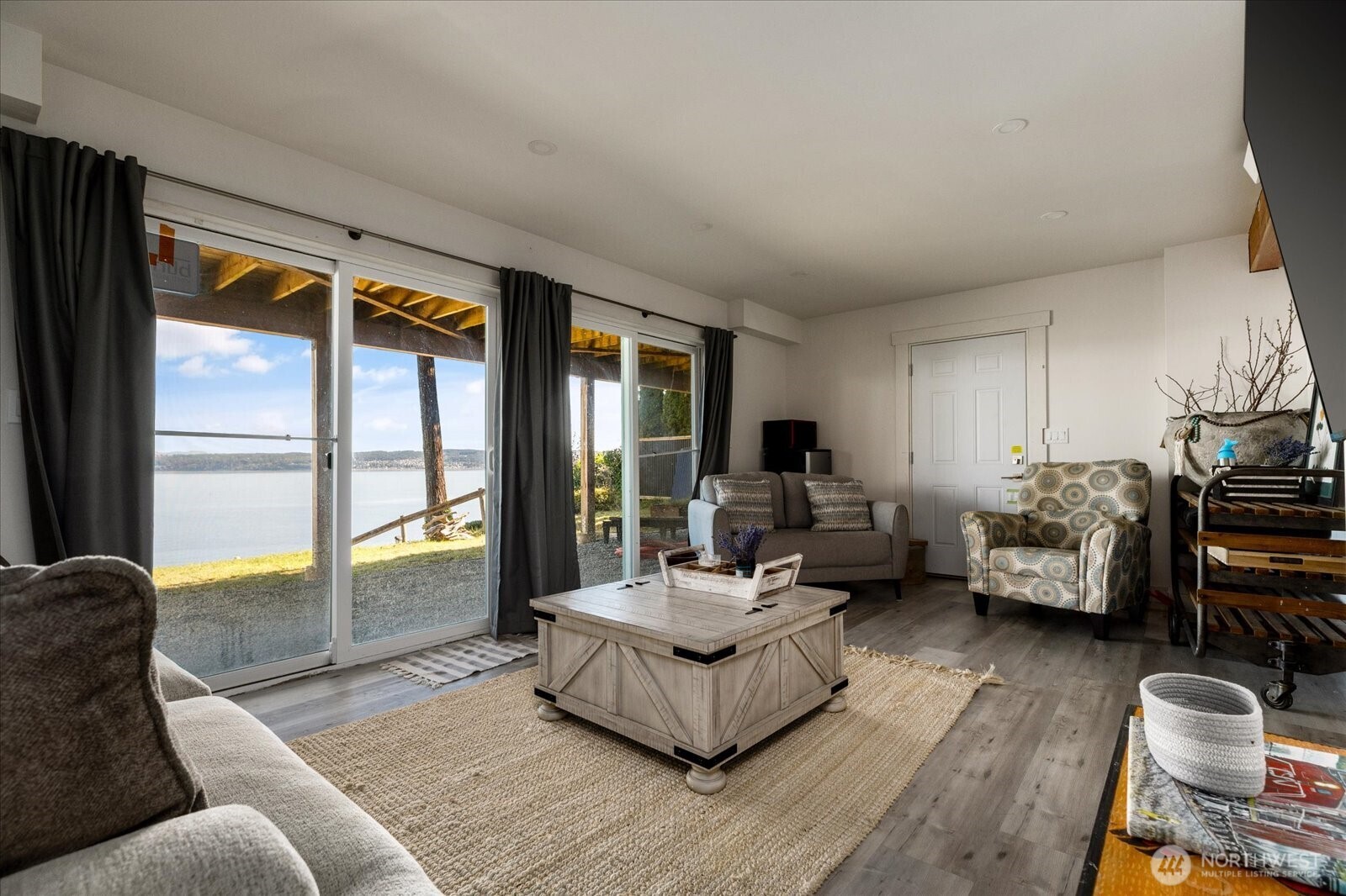 159 South Harrington Lagoon Road Coupeville, WA 98239 - Photo 25 of 37 a living room with furniture and a large window