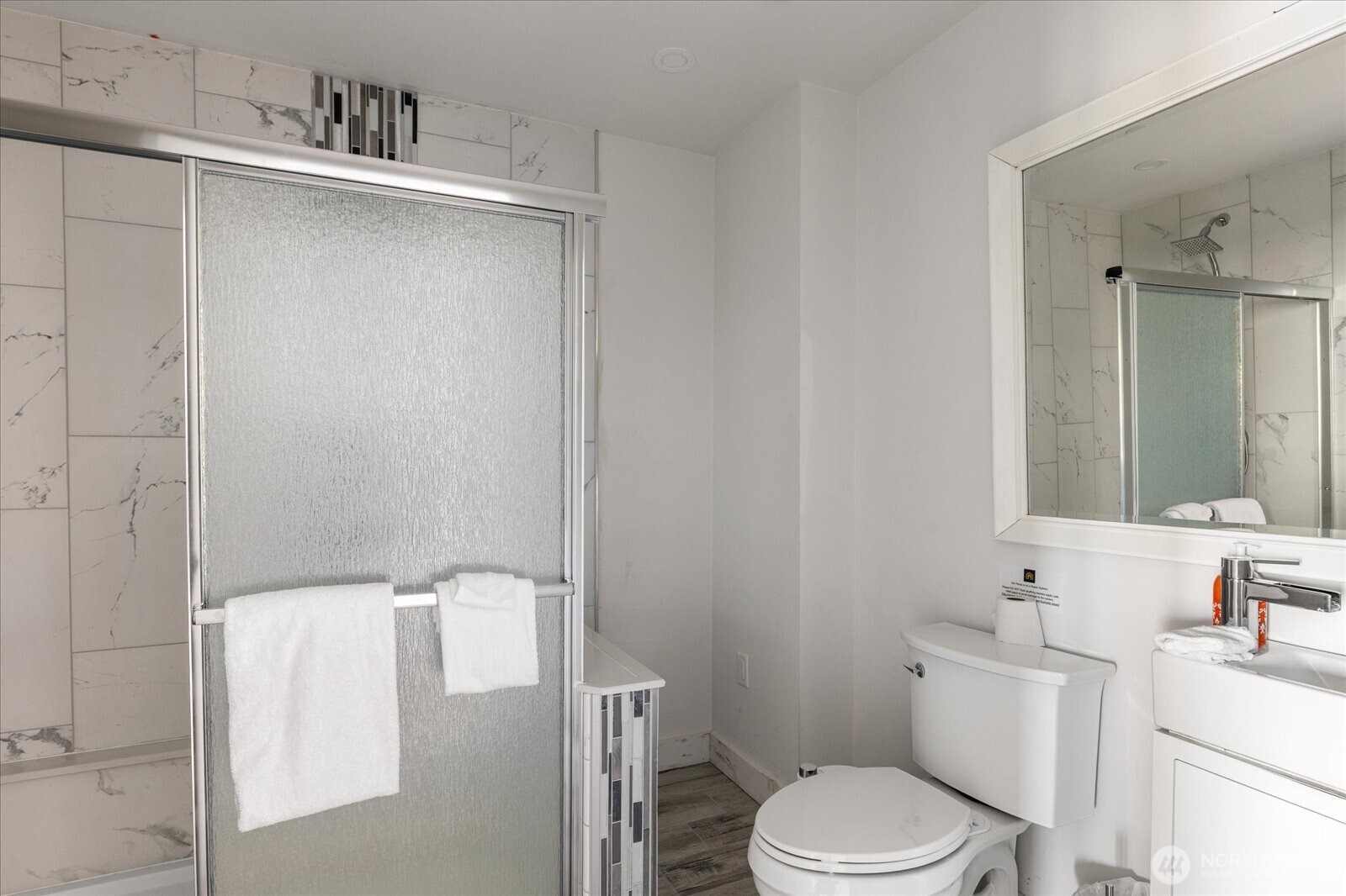 159 South Harrington Lagoon Road Coupeville, WA 98239 - Photo 27 of 37 a bathroom with a sink a toilet and mirror