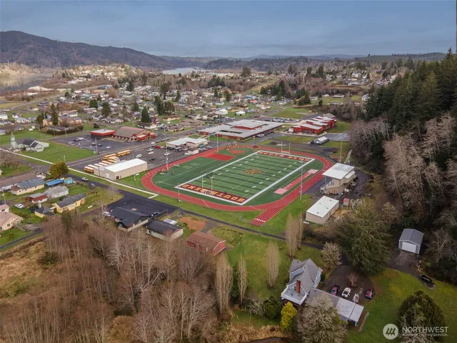 an aerial view of residential houses with outdoor space