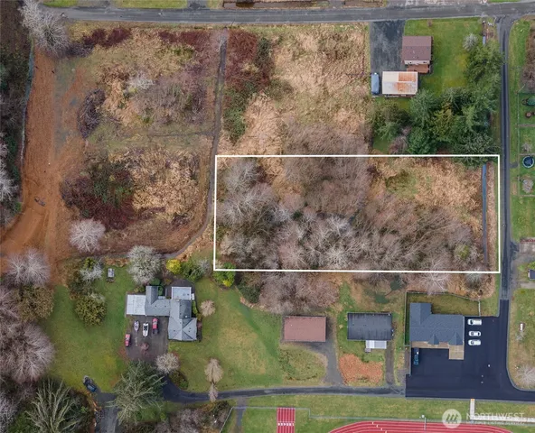 an aerial view of house with a yard
