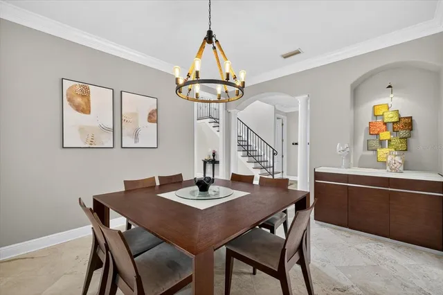 a view of a dining room and a table and chairs