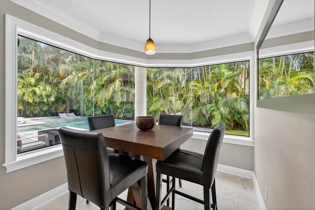 a dining room with furniture window wooden floor