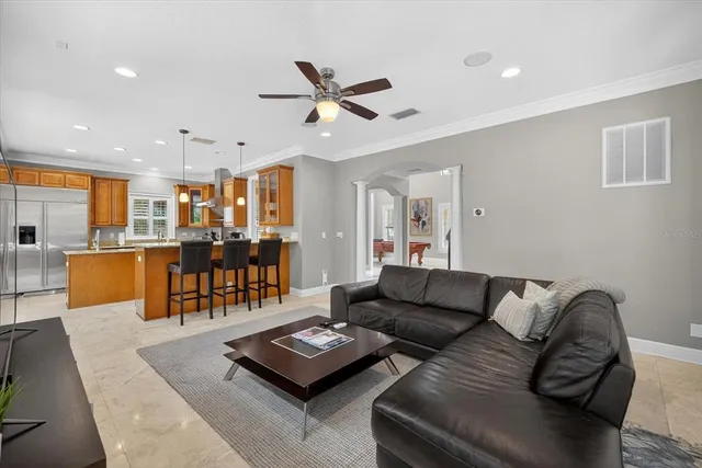 a view of a hallway view with staircase and white walls