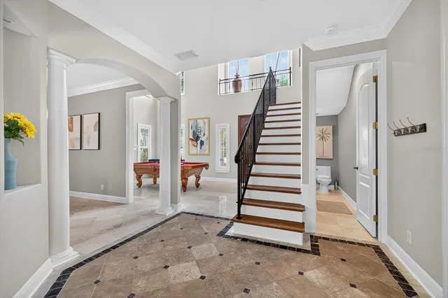 a bedroom with a bed wooden floor and window