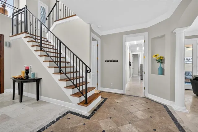 a bedroom with a large bed and a flat screen tv