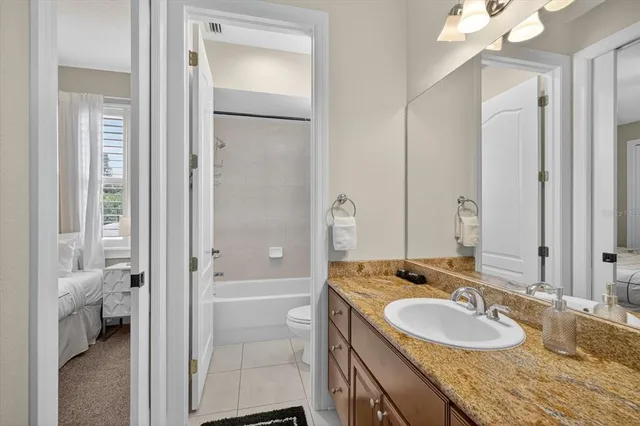 a bathroom with a bathtub and shower