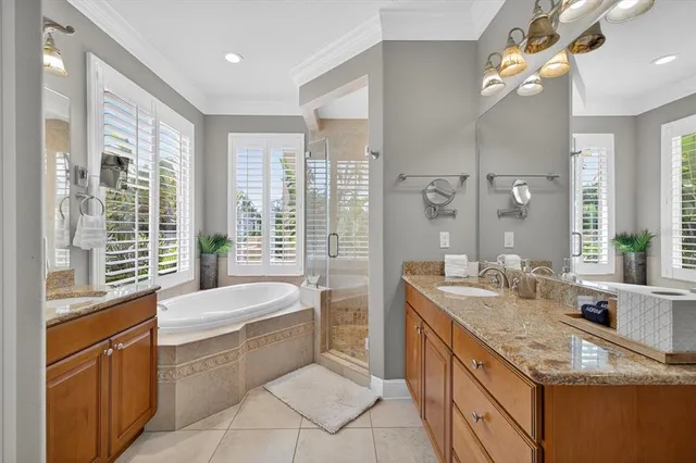 a front view of a house with yard and parking