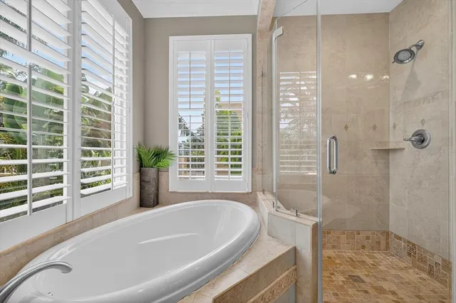 an aerial view of house with yard and mountain view in back