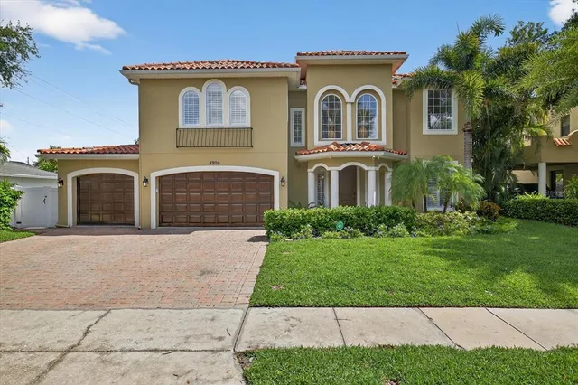 a dining hall with stainless steel appliances granite countertop a granite counter tops and a view of living room
